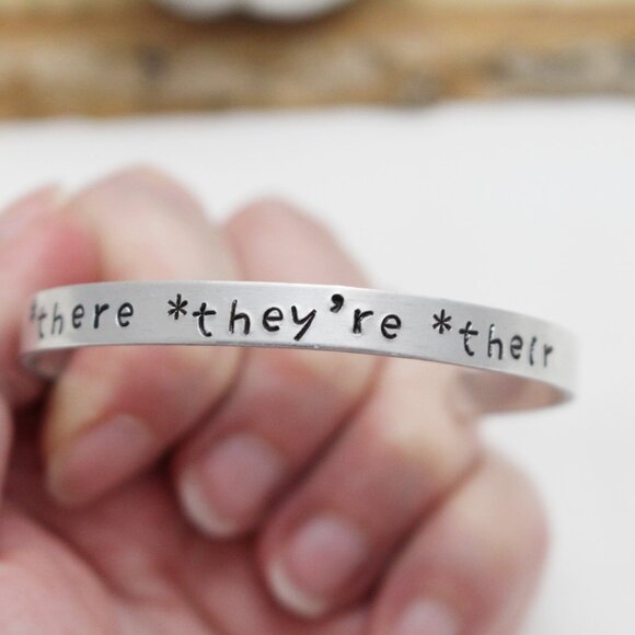 *There *They're *Their - Hand Stamped Anodized Aluminum Bangle - Adjustable - Picture 4 of 14